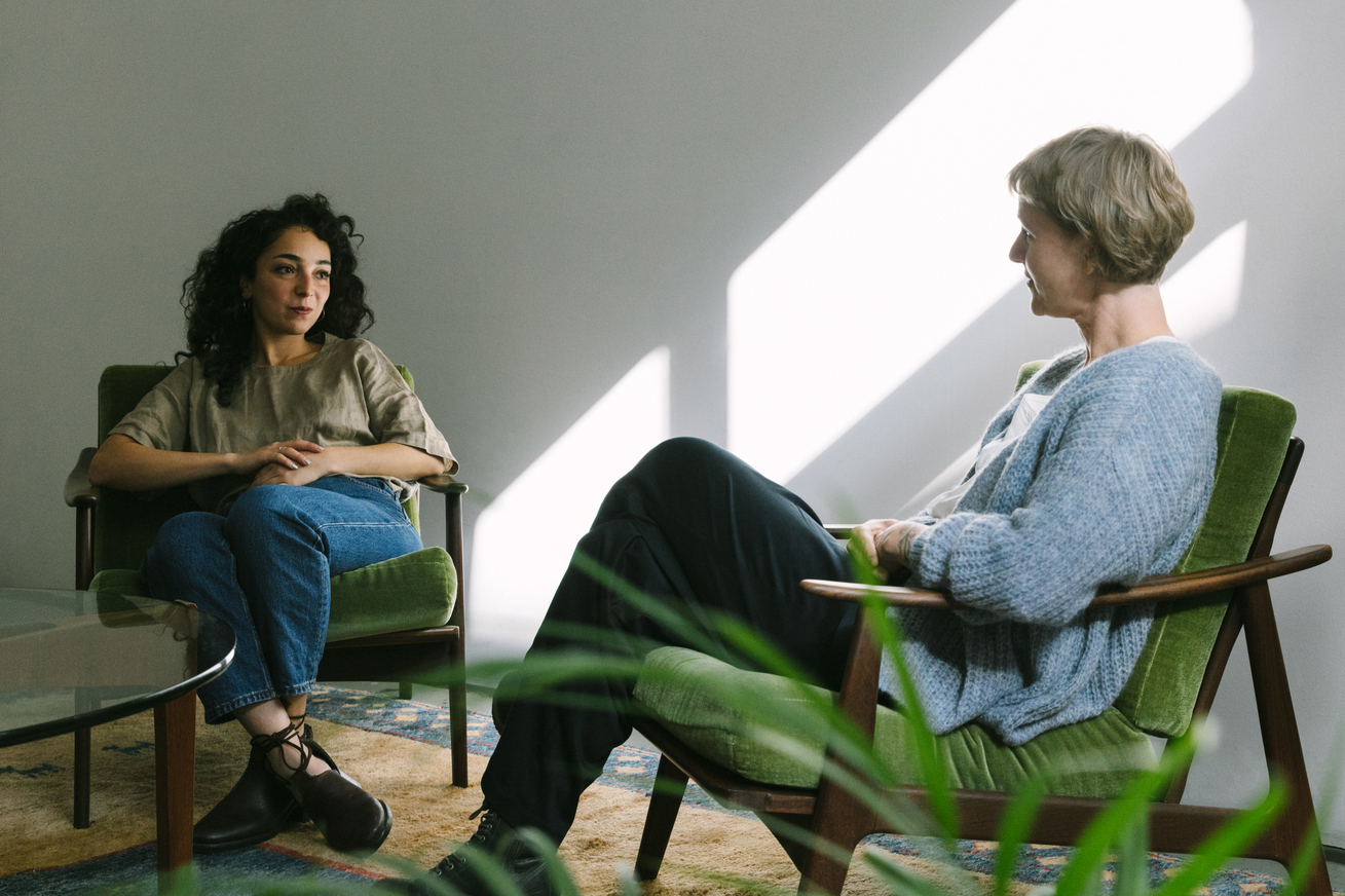 Two women are talking about mental health